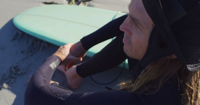 Surfer Relaxing on Beach Next to Surfboard - Download Free Stock Images Pikwizard.com