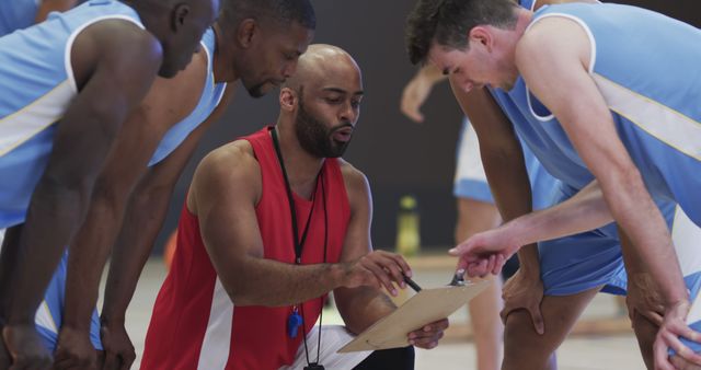 Basketball Coach Giving Team Instructions During Game Time Out - Download Free Stock Images Pikwizard.com