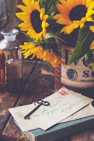Vintage decor: old keys and letters with sunflowers