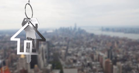 House-Shaped Keychain with Urban Cityscape