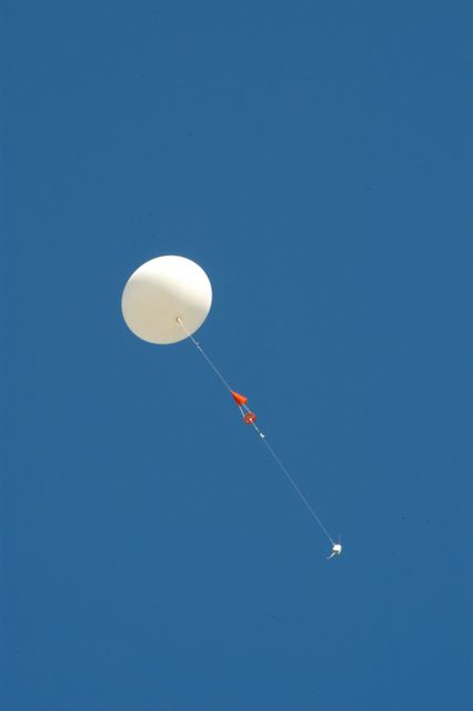A weather balloon takes flight from the Cape Canaveral Air Force Station weather station. The balloon is equipped with a radiosonde, an instrument that transmits measurements on atmospheric pressure, humidity, temperature and winds as it ascends. The data will be used to determine if conditions are acceptable for the launch of NASA's THEMIS mission. THEMIS, an acronym for Time History of Events and Macroscale Interactions during Substorms, consists of five identical probes that will track violent, colorful eruptions near the North Pole. This will be the largest number of scientific satellites NASA has ever launched into orbit aboard a single rocket. The THEMIS mission aims to unravel the mystery behind auroral substorms, an avalanche of magnetic energy powered by the solar wind that intensifies the northern and southern lights. The mission will investigate what causes auroras in the Earth’s atmosphere to dramatically change from slowly shimmering waves of light to wildly shifting streaks of bright color. Launch is planned from Pad 17-B in a window that extends from 6:01 to 6:19 p.m. EST.