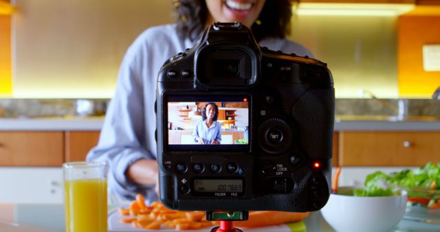 Smiling Female Chef Recording Cooking Vlog in Kitchen - Download Free Stock Images Pikwizard.com