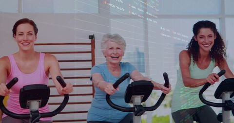 Women of All Ages Enjoying Stationary Cycling Workout Together