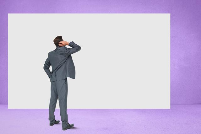 This image shows a businessman in a suit standing with his back to the viewer, looking at a blank billboard against a purple wall. It can be used for themes related to decision making, business strategy, marketing, and advertising. Ideal for presentations, articles, and websites focusing on business planning and corporate strategies.