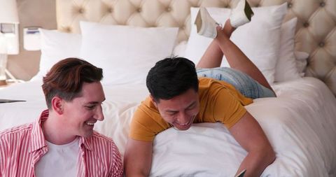Diverse Male Couple Enjoying Time Together on Bed