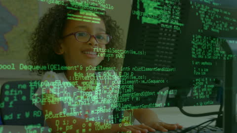 African American Girl Grinning While Engaging With Programming Code on Computer
