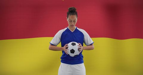 Biracial Female Soccer Player Holding Ball with National Pride - Download Free Stock Images Pikwizard.com