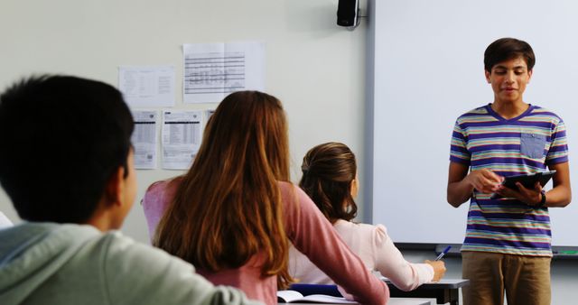 Teen Student Giving Presentation in Class Using Tablet - Download Free Stock Images Pikwizard.com