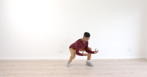 Dynamic Man Dancing in Bright Spacious Room