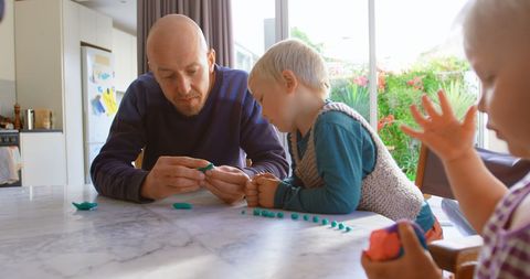 Father Engaging with Children in Creative Activity at Home - Download Free Stock Images Pikwizard.com