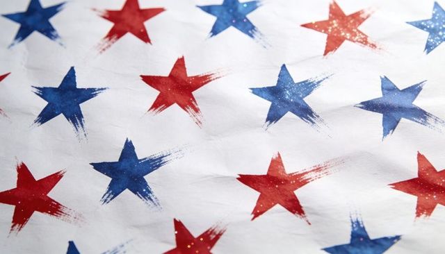 Hand-painted red and blue stars pattern on white fabric featuring brushed texture