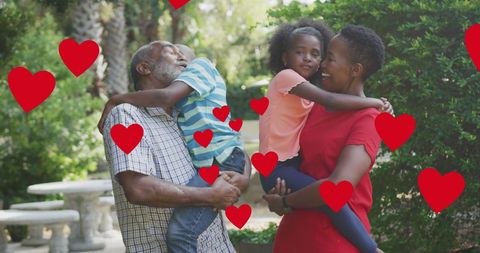 Multigenerational African American Family Embracing in Garden