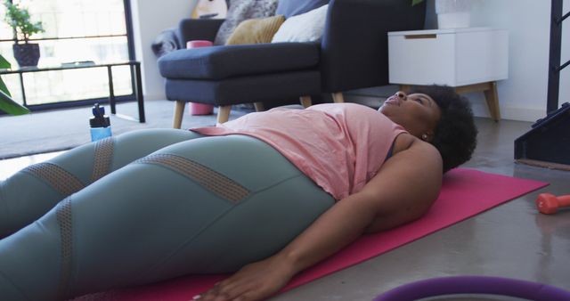 Woman Relaxing on Yoga Mat for Home Exercise - Download Free Stock Images Pikwizard.com