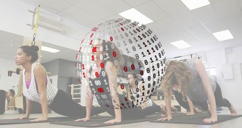 Women stretching in yoga class performing backbends with digital binary globe overlay