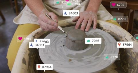 Potter trimming spinning clay on wheel with floating social media likes and follows