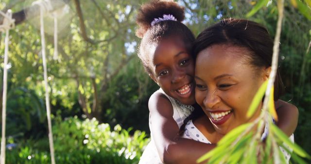 A hug between a mother and her daughter in a garden - Download Free Stock Photos Pikwizard.com