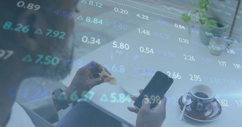Businessman Analyzing Stock Market while Eating at Cafe