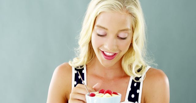 Smiling Woman Enjoying Healthy Breakfast with Berries and Yogurt - Download Free Stock Images Pikwizard.com