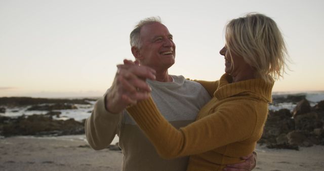 Romantic Senior Couple Dancing on Beach at Sunset - Download Free Stock Images Pikwizard.com