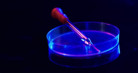 Glowing Pipette and Petri Dish in Lab Environment