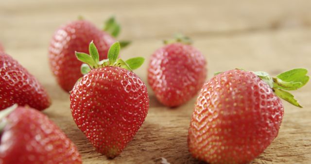 Close-up of fresh strawberries on wooden table