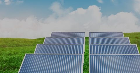 Row of Solar Panels on Lush Green Grass under Blue Sky - Download Free Stock Images Pikwizard.com