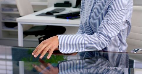 Business professional in striped shirt in modern office