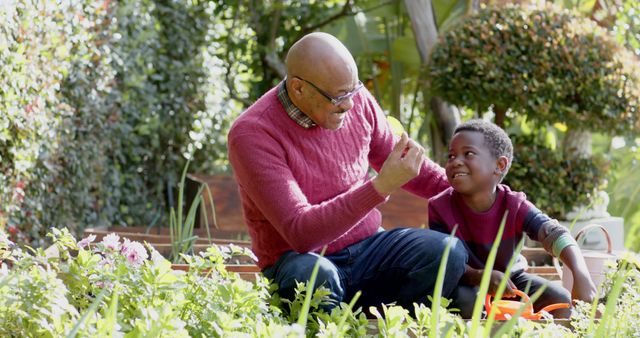 Grandfather Teaching Grandson Gardening in Beautiful Green Garden - Download Free Stock Images Pikwizard.com