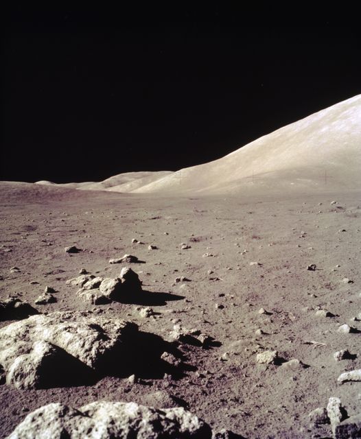 This view of the Lunar surface was taken during the Apollo 17 mission. The seventh and last manned lunar landing and return to Earth mission, the Apollo 17, carrying a crew of three astronauts: Mission Commander Eugene A. Cernan; Lunar Module pilot Harrison H. Schmitt; and Command Module pilot Ronald E. Evans, lifted off on December 7, 1972 from the Kennedy Space Flight Center (KSC). Scientific objectives of the Apollo 17 mission included geological surveying and sampling of materials and surface features in a preselected area of the Taurus-Littrow region, deploying and activating surface experiments, and conducting in-flight experiments and photographic tasks during lunar orbit and transearth coast (TEC). These objectives included: Deployed experiments such as the Apollo lunar surface experiment package (ALSEP) with a Heat Flow experiment, Lunar seismic profiling (LSP), Lunar surface gravimeter (LSG), Lunar atmospheric composition experiment (LACE) and Lunar ejecta and meteorites (LEAM). The mission also included Lunar Sampling and Lunar orbital experiments. Biomedical experiments included the Biostack II Experiment and the BIOCORE experiment. The mission marked the longest Apollo mission, 504 hours, and the longest lunar surface stay time, 75 hours, which allowed the astronauts to conduct an extensive geological investigation. They collected 257 pounds (117 kilograms) of lunar samples with the use of the Marshall Space Flight Center designed Lunar Roving Vehicle (LRV). The mission ended on December 19, 1972.