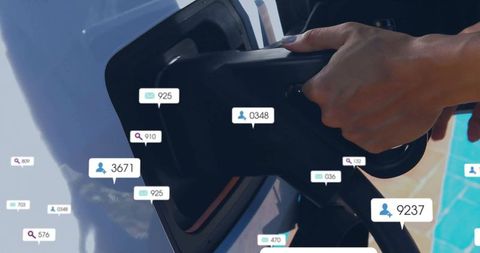 Hand Charging Electric Vehicle with Digital Social Metrics Overlaid