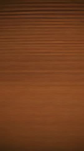Vertical woodgrain panel shifting warm light across horizontal ridges and subtle bands