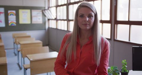 Confident Teacher in Classroom Setting