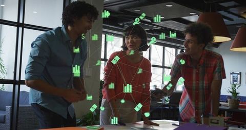 Startup team collaborating with augmented reality data overlay in modern coworking space