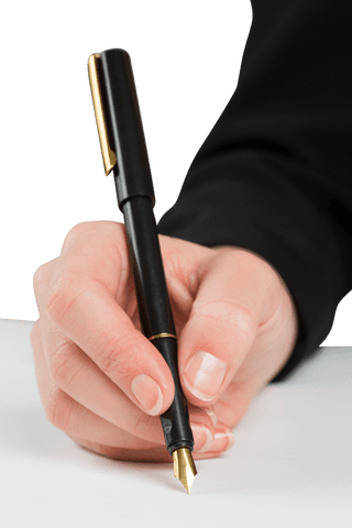 Close-up of businesswoman's hand holding fountain pen