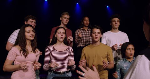 Teenage Choir Singers Performing on Stage