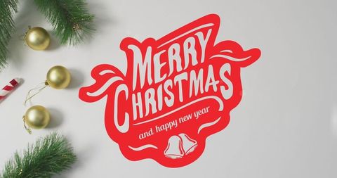 Festive Christmas Greeting with Ornaments and Pine Sprigs