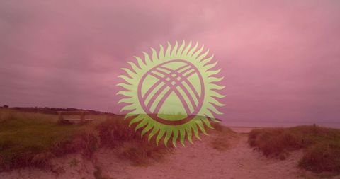Scenic sandy pathway through dunes toward serene beach