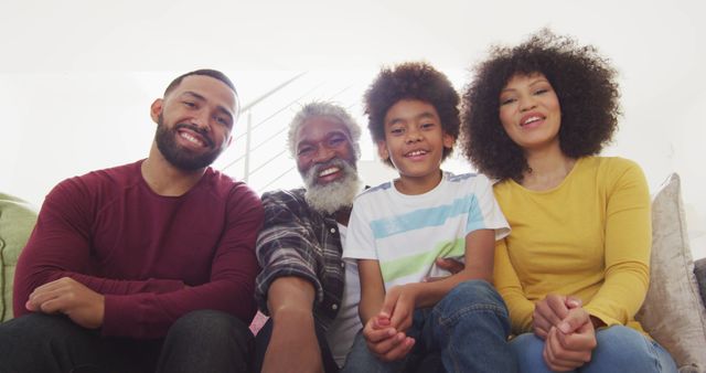 Smiling African American Family Sitting Together on Sofa at Home - Download Free Stock Images Pikwizard.com