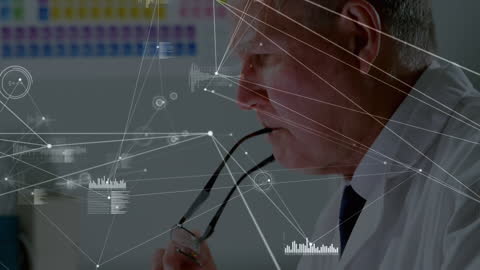 Senior Doctor Analyzing Data on Computer Interface