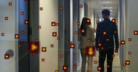 Dynamic Digital Network with Business Professionals in Office Hallway