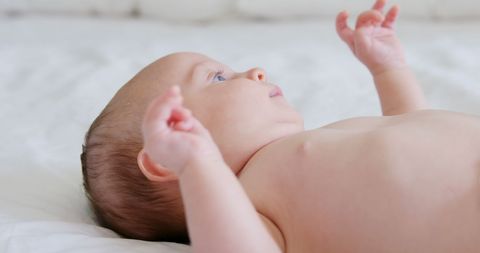 Peaceful Baby Resting on White Bedding - Download Free Stock Images Pikwizard.com