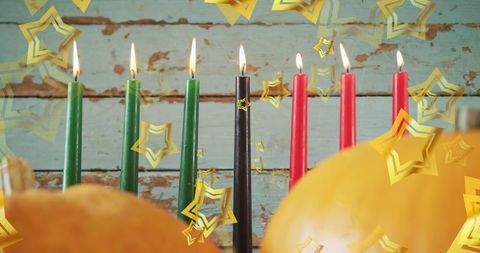 Kwanzaa Festival Candles with Pumpkins and Golden Stars