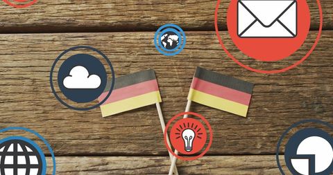 German Flags with Digital Icons on Wooden Background