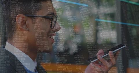 Speaking into smartphone while working with cybersecurity code overlay in modern office
