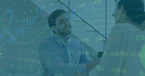 Business handshake overlaid with financial data visualization