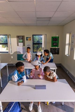 African american students exploring virtual reality in classroom collaboration
