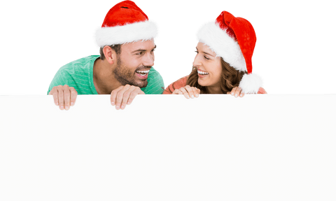 cheerful couple wearing santa hats holding transparent sign - Download Free Stock Videos Pikwizard.com