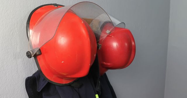 Protective workwear hanging on hook against wall 4k - Download Free Stock Photos Pikwizard.com
