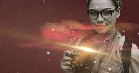 Young woman exploring space-themed digital art with camera