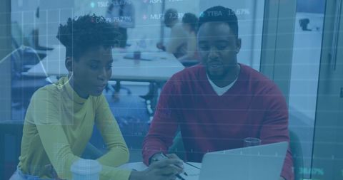 Diverse Colleagues Analyzing Financial Data Interface in Modern Office